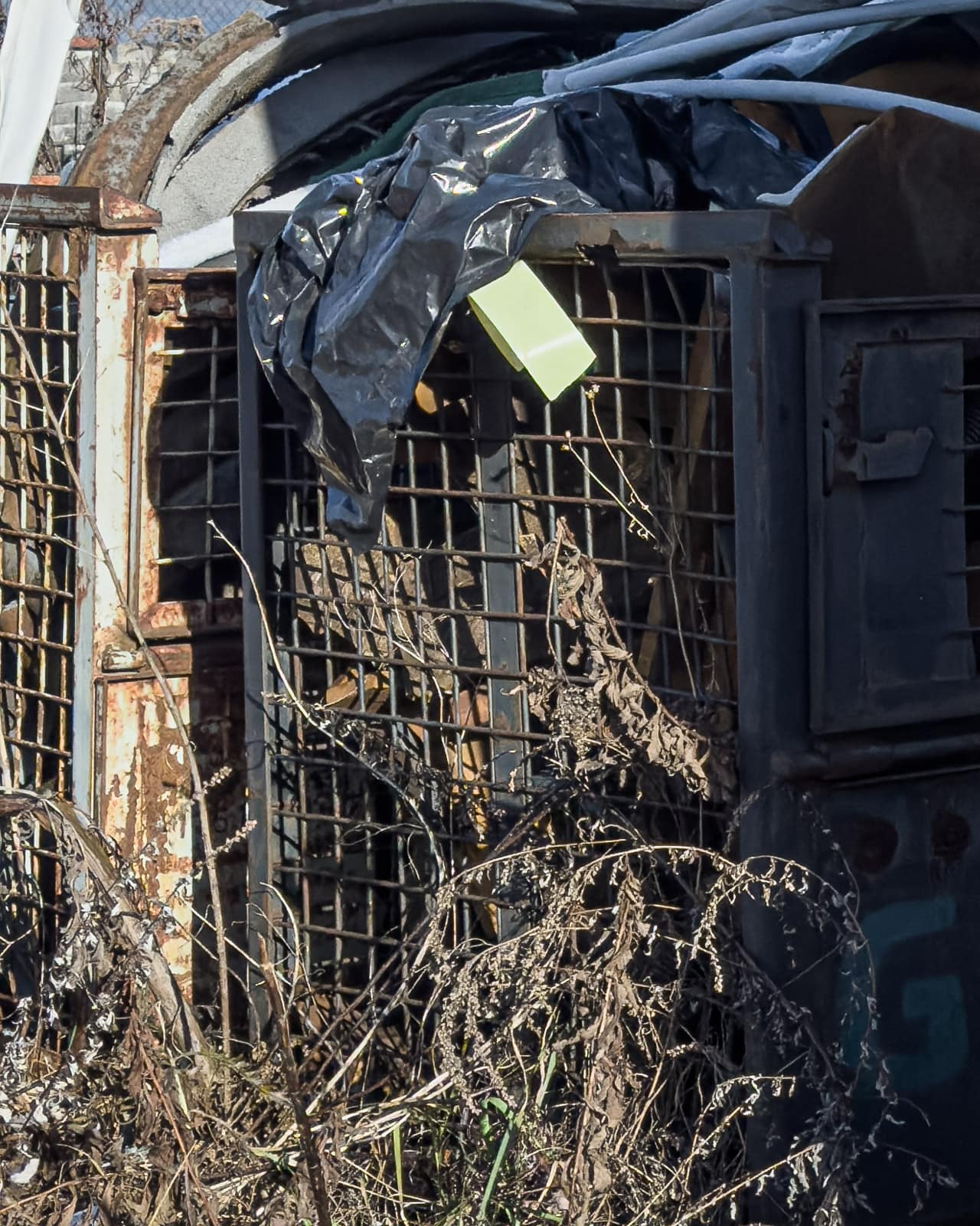 Damaged interior of an abandoned vending machine with exposed metal structure in Zeltweg